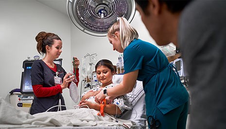 a patient and her care team in the new stanford hospital emergency room